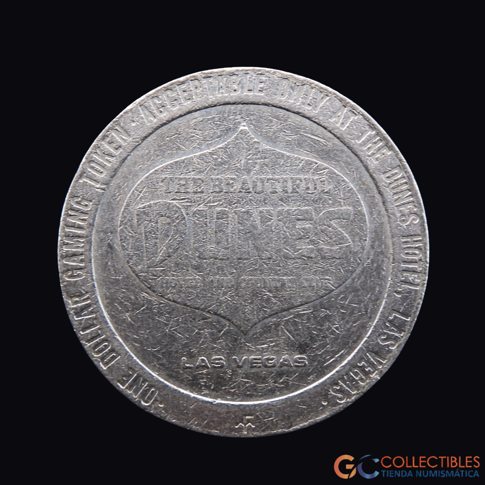Lote 2104 - The Dunes Hotel & Country Club – 1 Dollar Gaming Token – 1979